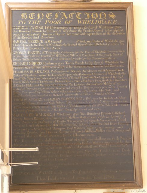 Photograph of the main Benefaction plaque in St. Helens's Church, Wheldrake.