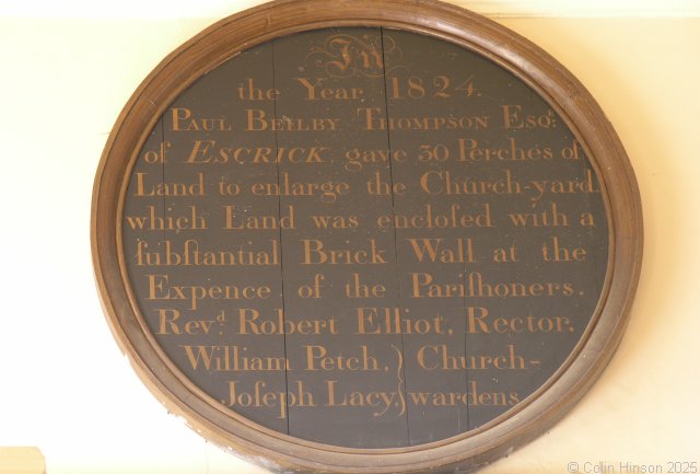 Photograph of the Thompson Benefaction plaque in St. Helens's Church, Wheldrake.