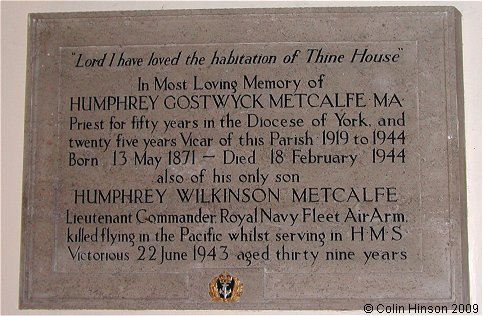 The Memorial plaque to the Vicar and his son in St. Felix's Church, Felixkirk.