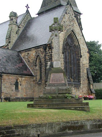 The the War Memorial in the churchyard at Great Ayton.