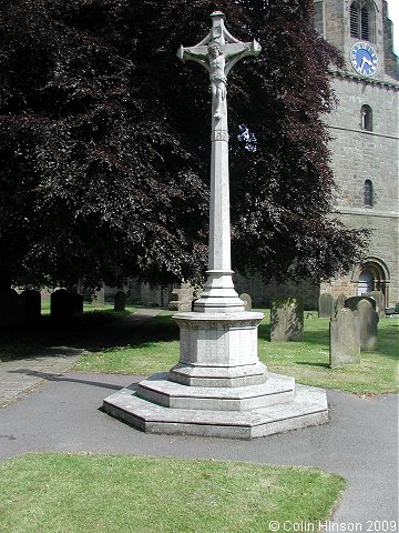 The World Wars I and II War Memorial in the Churchyard at Masham.