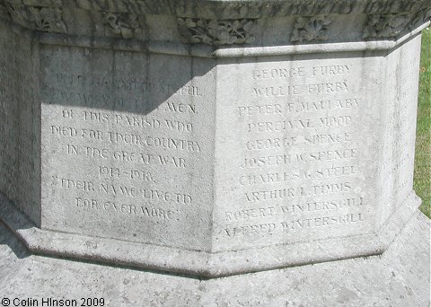 The World Wars I and II War Memorial in the Churchyard at Masham.