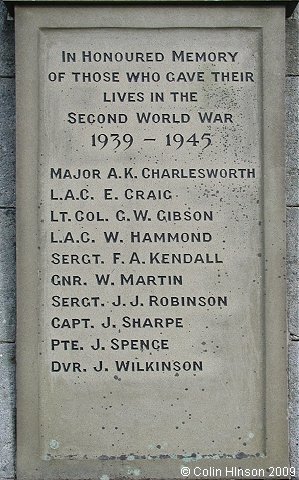 The World Wars I and II War Memorial on the green at Reeth.