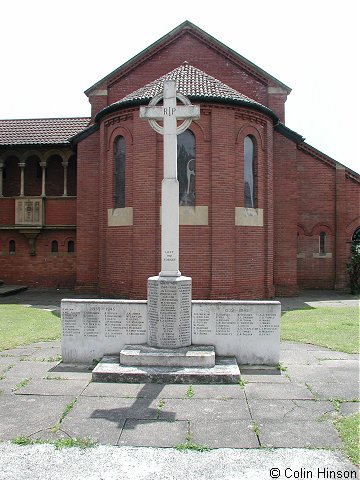 The 1914-18 and 1939-45 War Memorial in St. Philip and St. James' Churchyard, New Village.